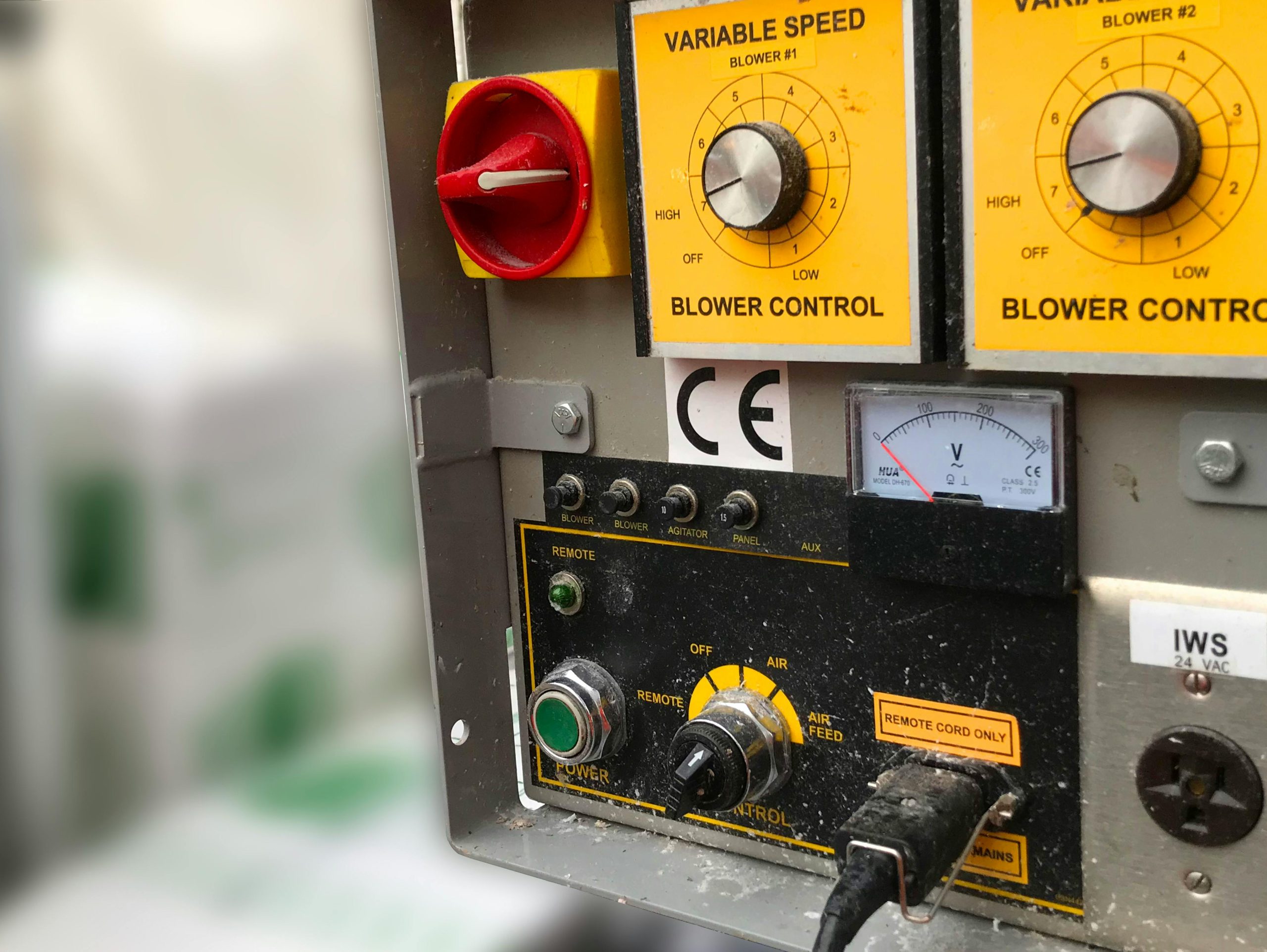 Detailed view of an industrial control panel with blower controls and meters in Crowthorne.